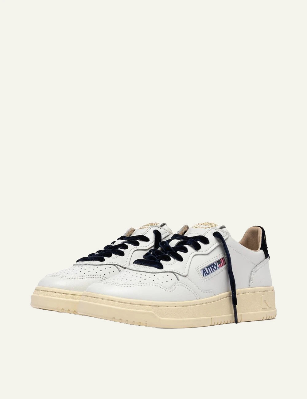 Autry women’s white leather sneakers with navy velvet details profile