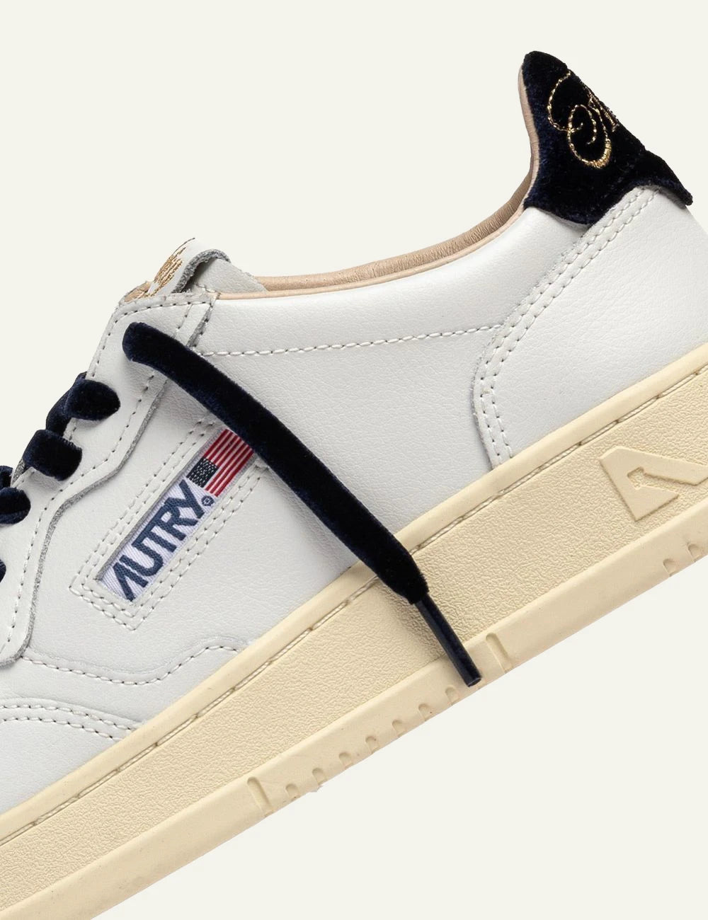 Autry women’s white leather sneakers with navy velvet details detail