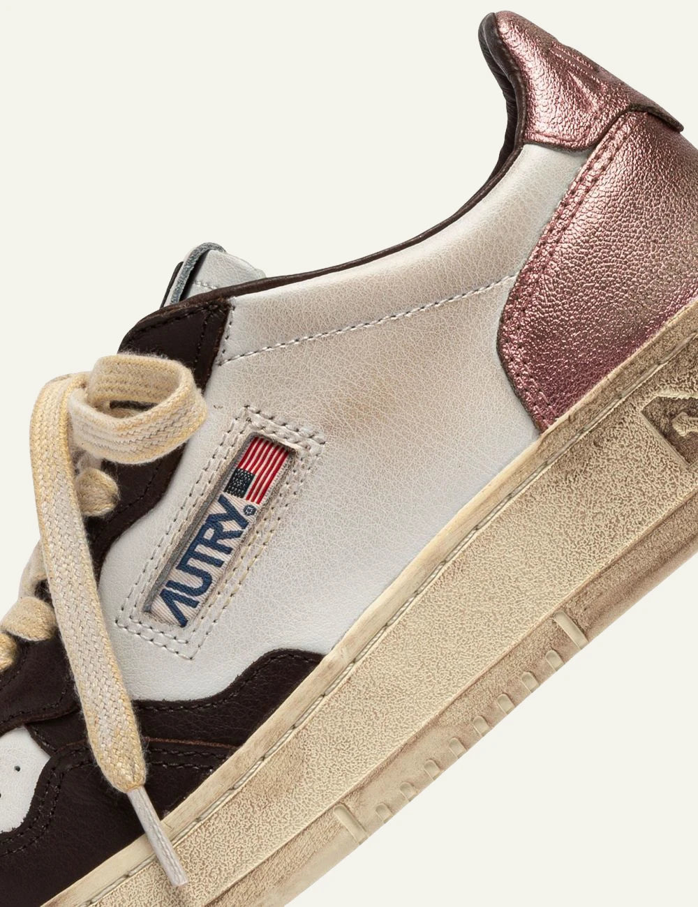 Autry women’s white leather sneakers with pink and dark brown vintage details logo