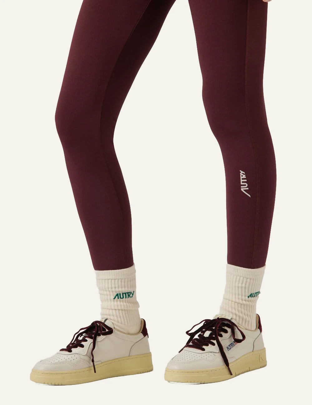 Autry women’s white leather sneakers with purple velvet details model