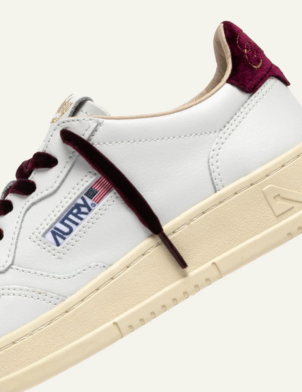 Autry women’s white leather sneakers with purple velvet details logo
