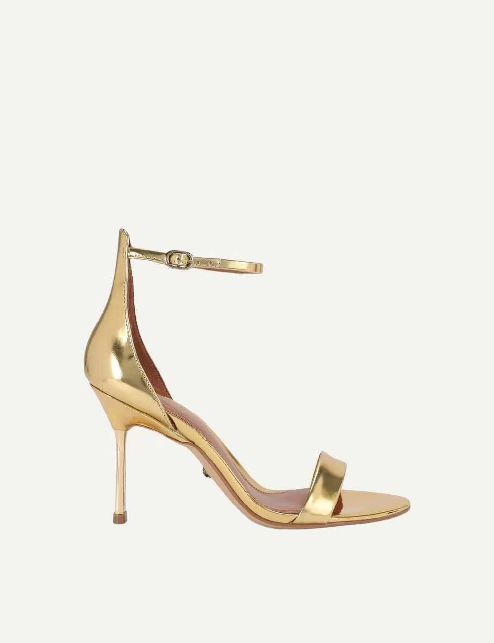 Kurt Geiger London Bank Drench metallic gold patent leather heeled sandals with front strap, adjustable ankle buckle and gold stiletto heel.