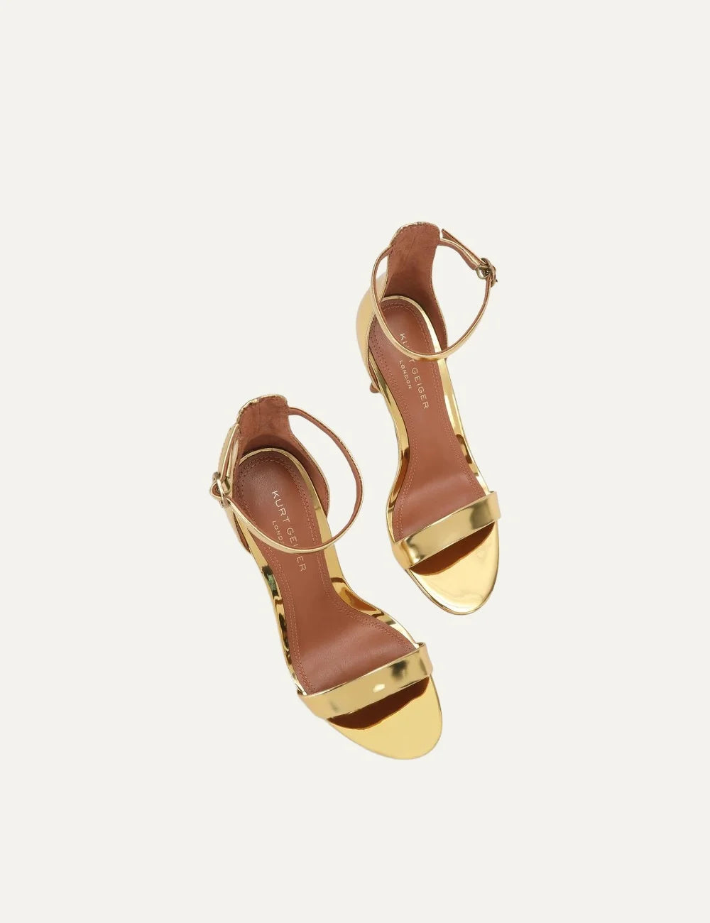Kurt Geiger London Bank Drench metallic gold patent leather heeled sandals with front strap, adjustable ankle buckle and gold stiletto heel top