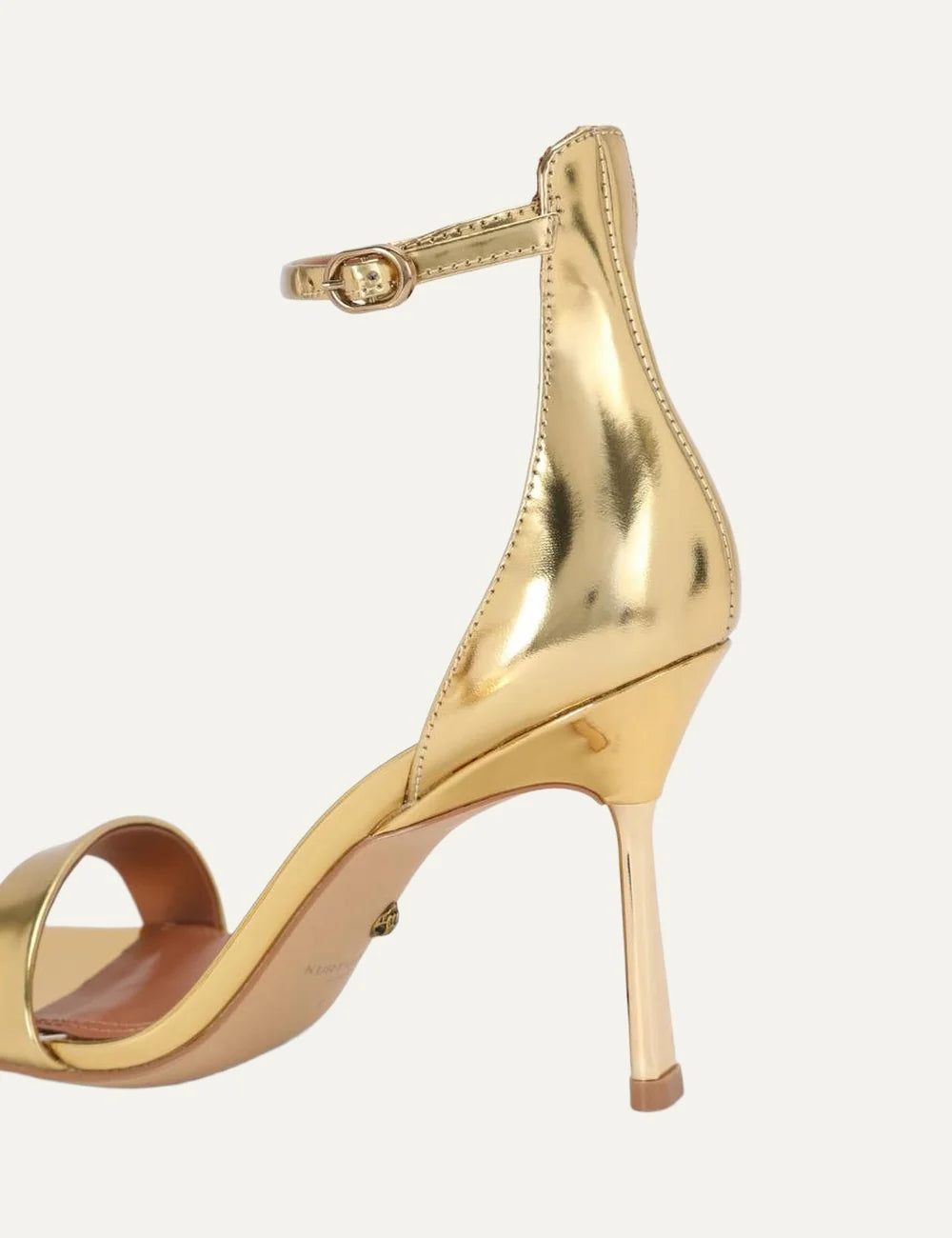 Kurt Geiger London Bank Drench metallic gold patent leather heeled sandals with front strap, adjustable ankle buckle and gold stiletto heel back detail
