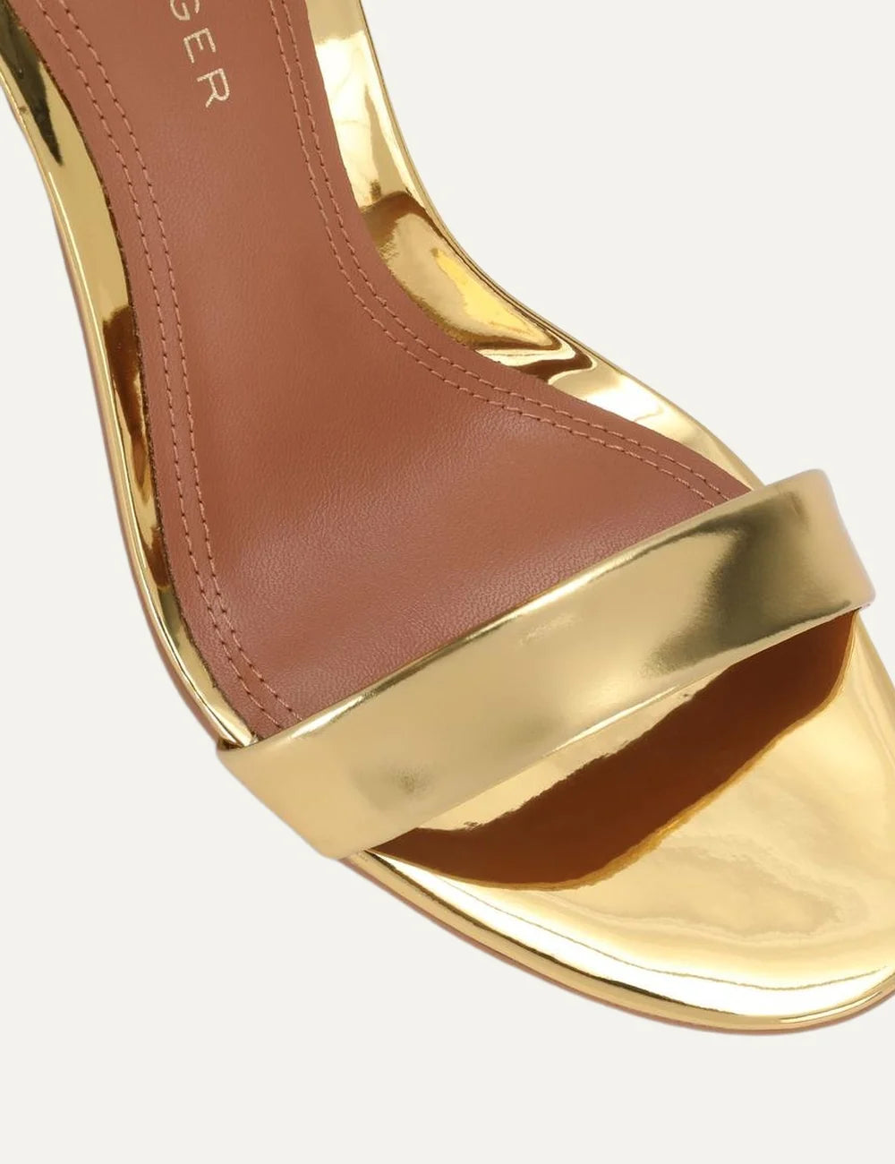 Kurt Geiger London Bank Drench metallic gold patent leather heeled sandals with front strap, adjustable ankle buckle and gold stiletto heel detail