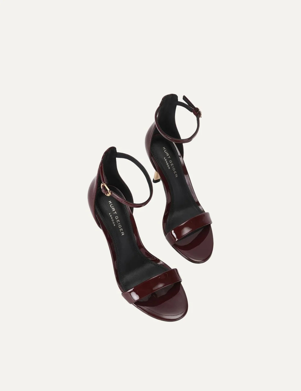 Kurt Geiger London Bank Drench wine burgundy patent leather heeled sandals with ankle strap, gold buckle and gold stiletto heel top