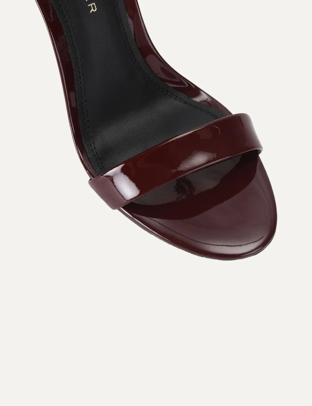 Kurt Geiger London Bank Drench wine burgundy patent leather heeled sandals with ankle strap, gold buckle and gold stiletto heel top