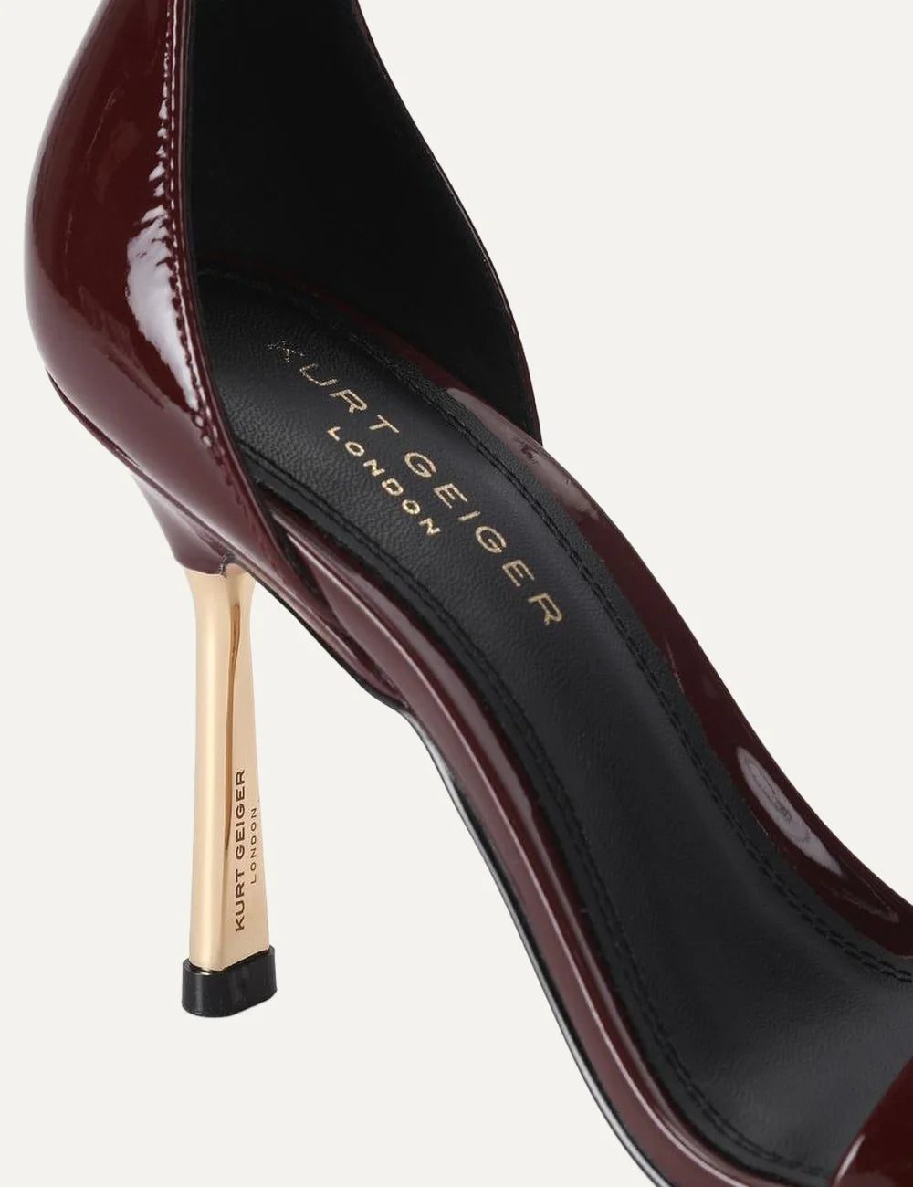 Kurt Geiger London Bank Drench wine burgundy patent leather heeled sandals with ankle strap, gold buckle and gold stiletto heel detail
