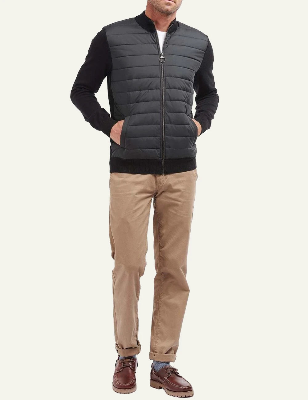 Men's Barbour black quilted jacket with knitted sleeves and zip closure full body