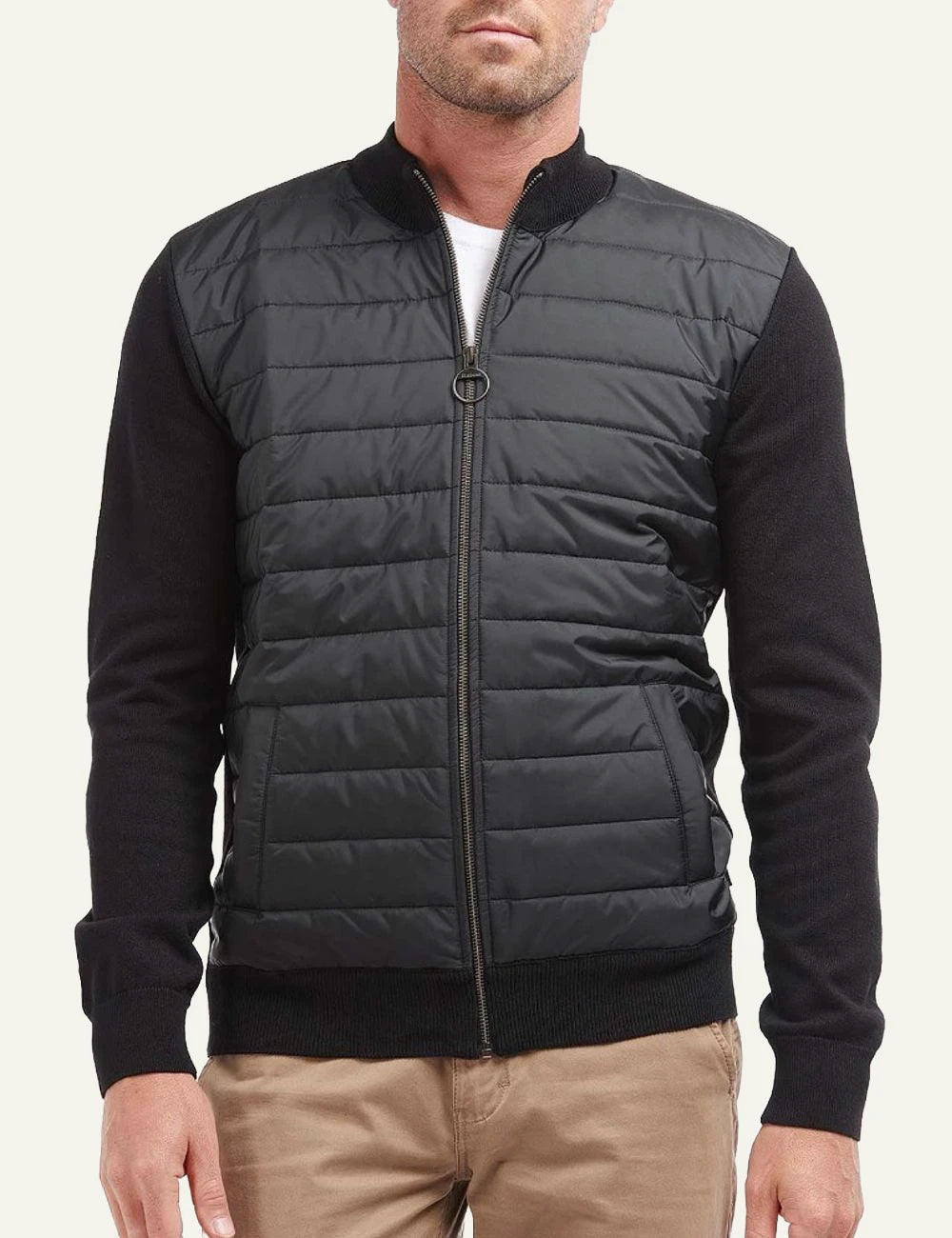 Men's Barbour black quilted jacket with knitted sleeves and zip closure model