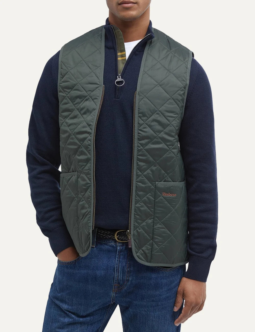 Barbour men's green diamond quilted nylon waistcoat with tartan lining and front patch pockets model
