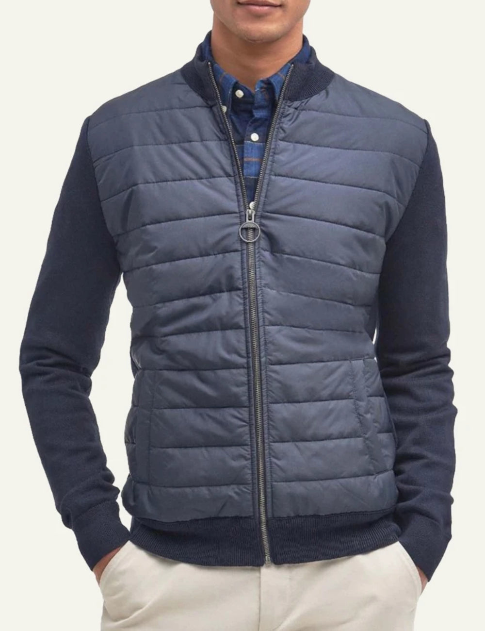 Men's Barbour navy blue quilted jacket with knitted sleeves and zip closure model