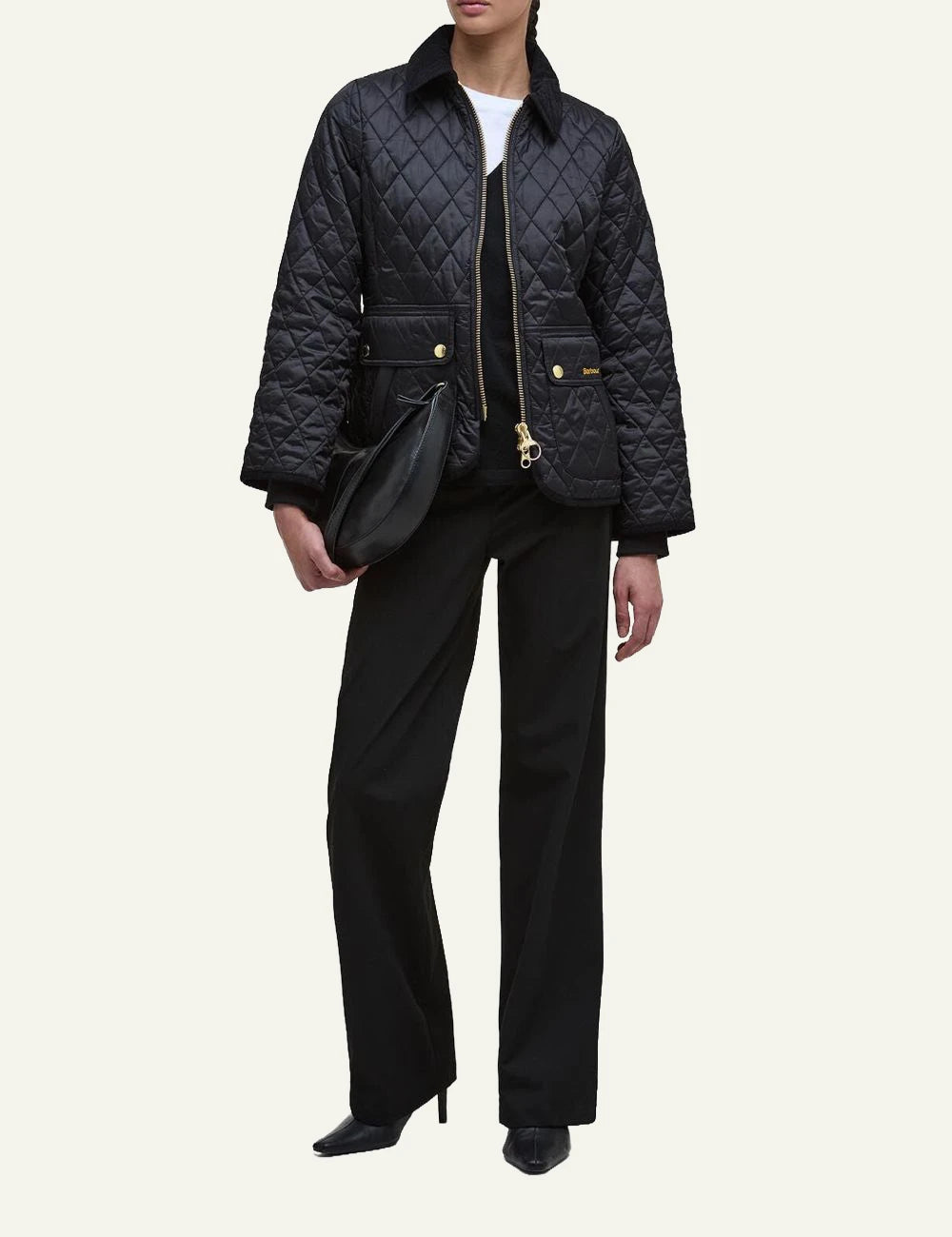 Women's Barbour black fitted quilted jacket with corduroy collar and gold-tone zip full body