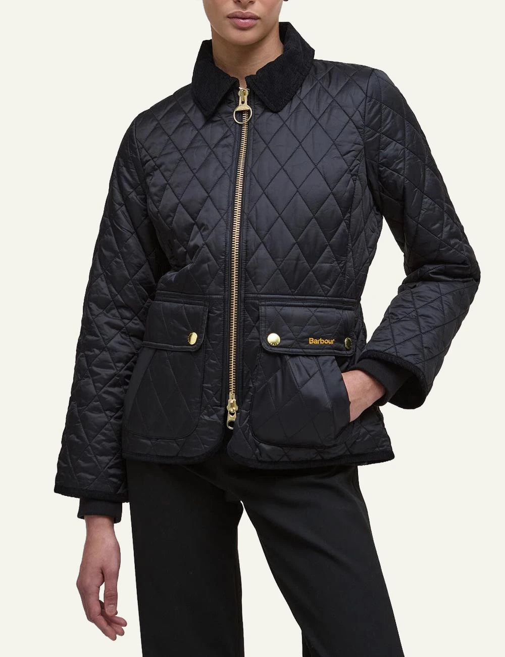 Women's Barbour black fitted quilted jacket with corduroy collar and gold-tone zip model