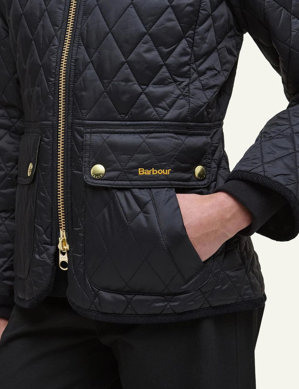 Women's Barbour black fitted quilted jacket with corduroy collar and gold-tone zip back
