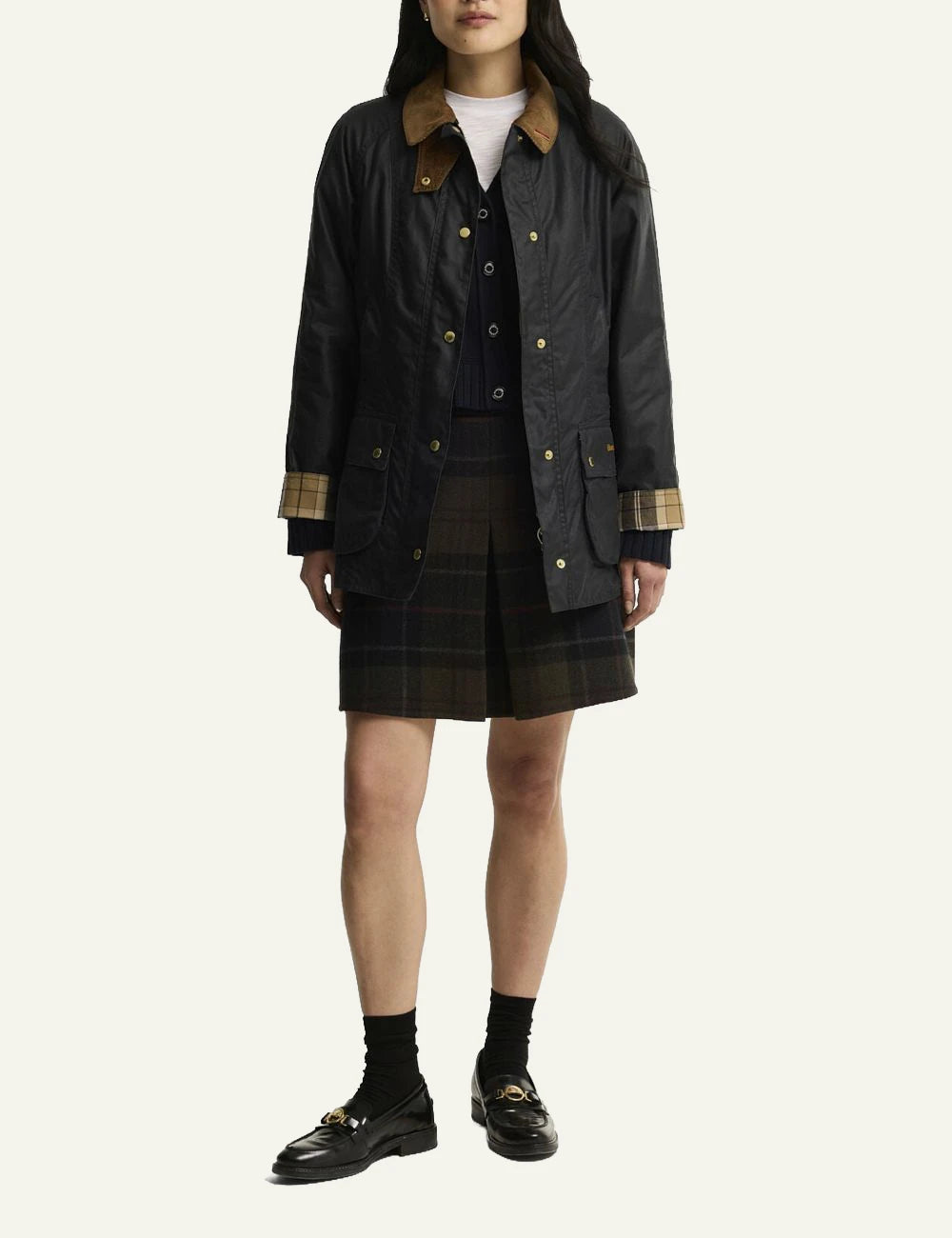 Women's Barbour dark navy waxed cotton jacket with brown corduroy collar and gold-tone buttons full body