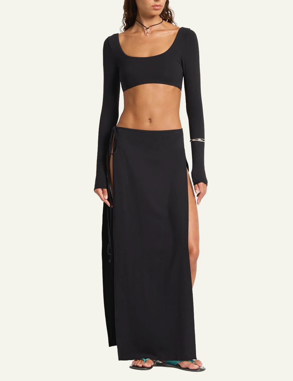 Bound black maxi skirt high slit front view