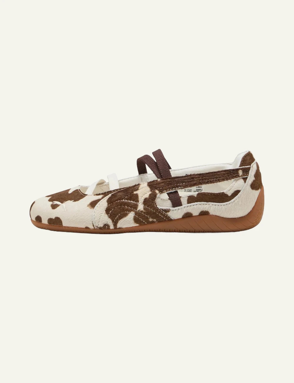 Brown and white cow print ballet flats with elastic straps profil view