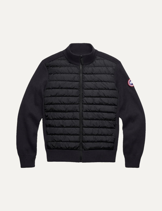 Canada Goose men's HyBridge Knit Jacket in black merino wool with down-filled quilted front, ribbed collar and cuffs, zip closure and logo patch
