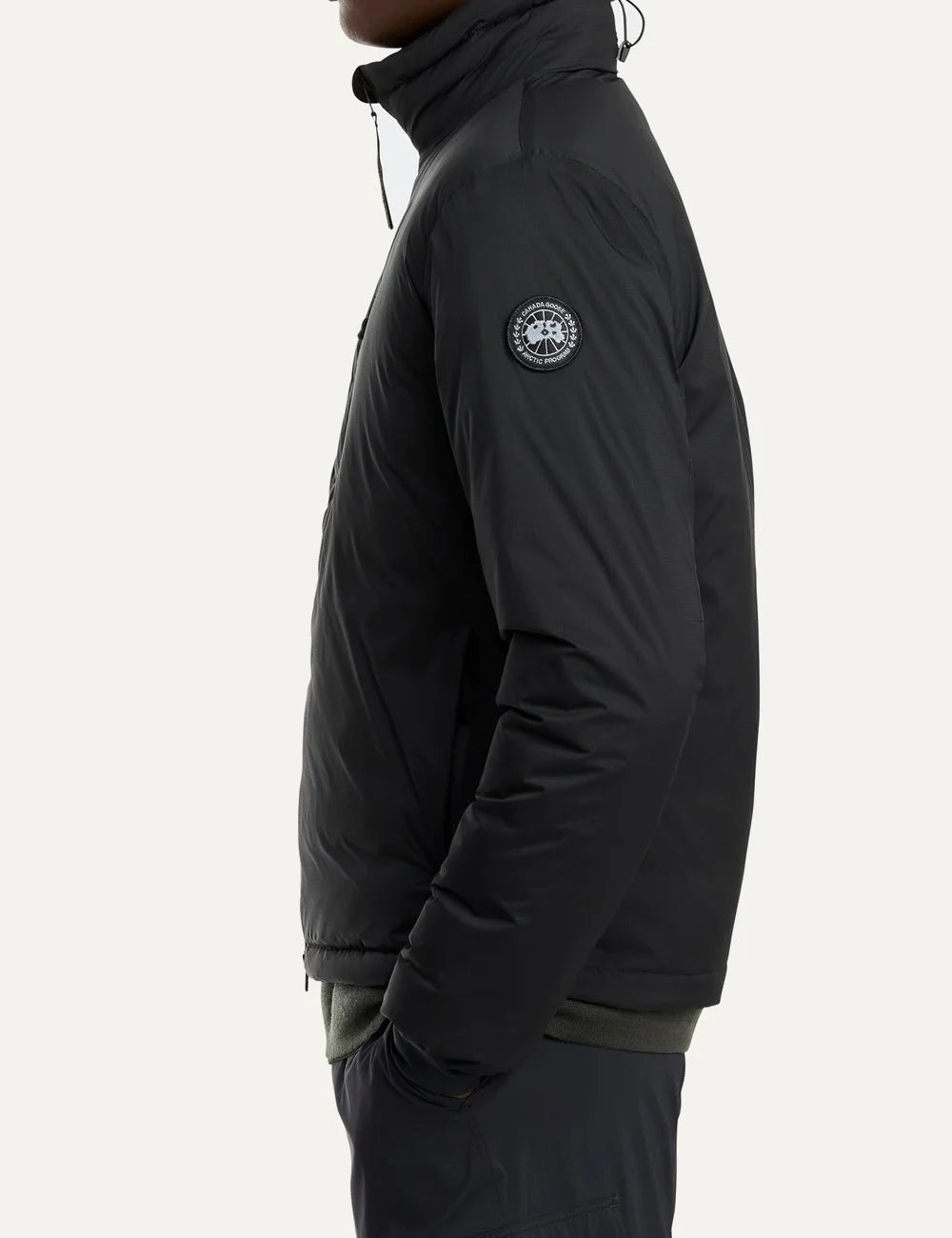 Canada Goose men's Lodge Jacket in black with down insulation, stand collar, two-way zipper, zippered pockets and logo patch side