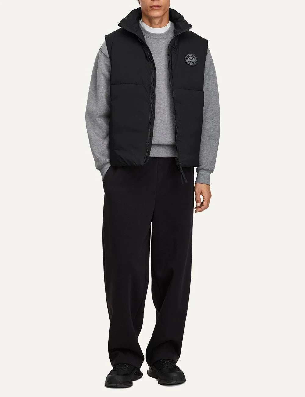 Canada Goose men's Lodge Vest black lightweight water-repellent and wind-resistant puffer vest with high collar, two-way zipper and logo patch full body