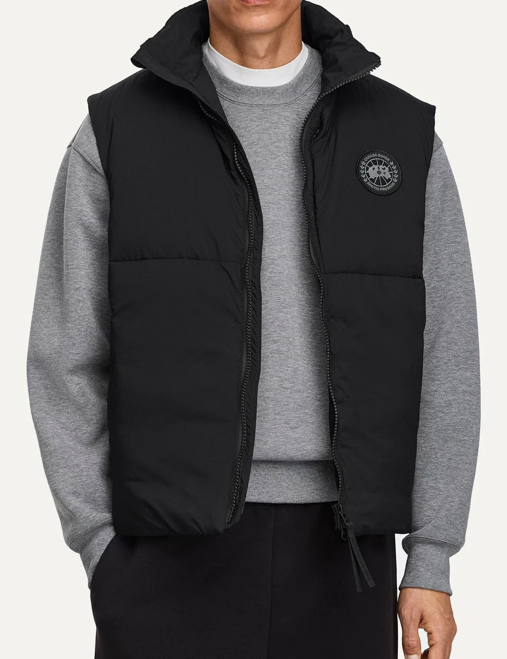 Canada Goose men's Lodge Vest black lightweight water-repellent and wind-resistant puffer vest with high collar, two-way zipper and logo patch model