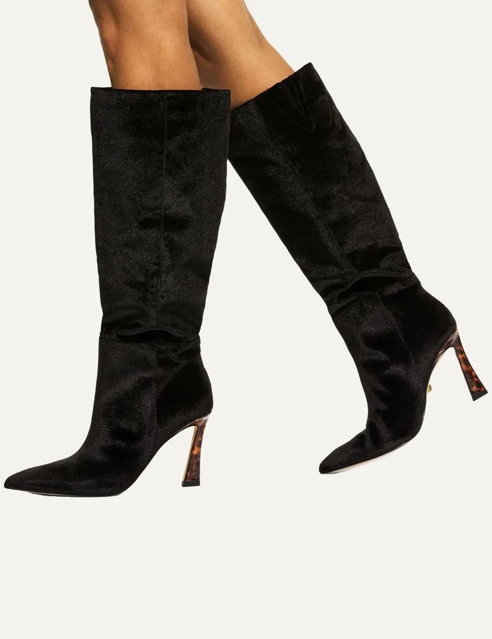 Kurt Geiger women's Annabel knee-high boots in black velvet featuring a pointed toe, soft ruching at the ankle and a 9cm flared stiletto heel with tortoiseshell effect model