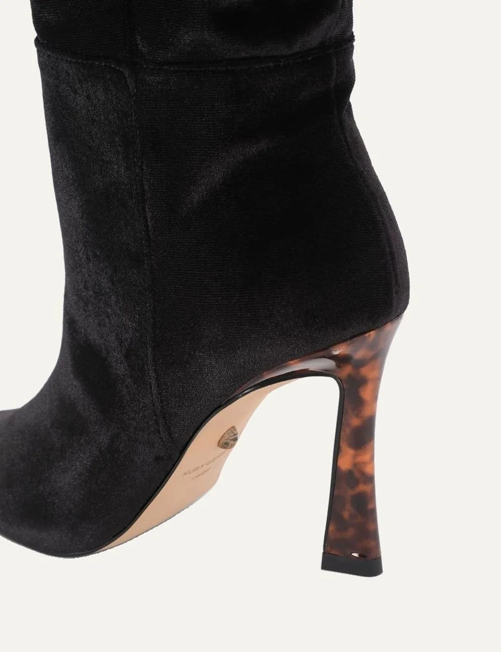 Kurt Geiger women's Annabel knee-high boots in black velvet featuring a pointed toe, soft ruching at the ankle and a 9cm flared stiletto heel with tortoiseshell effect detail