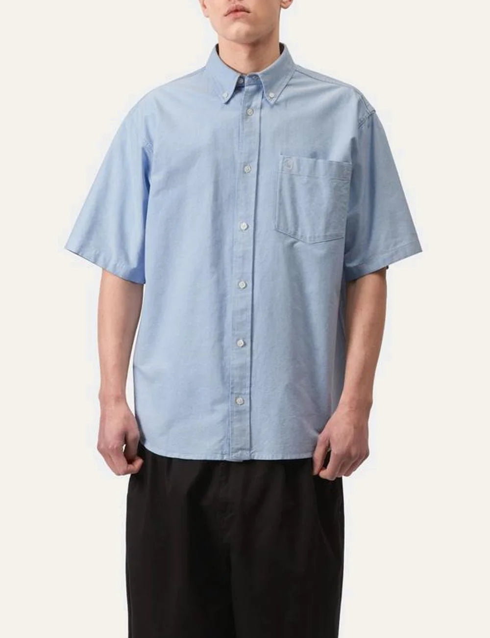 Carhartt WIP light blue short sleeve button-down shirt with chest pocket front model view