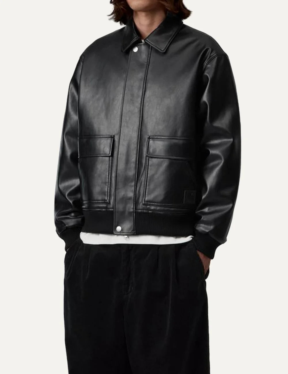 Carhartt WIP men Arizona black faux leather jacket with quilted lining, patch pockets and ribbed trims model