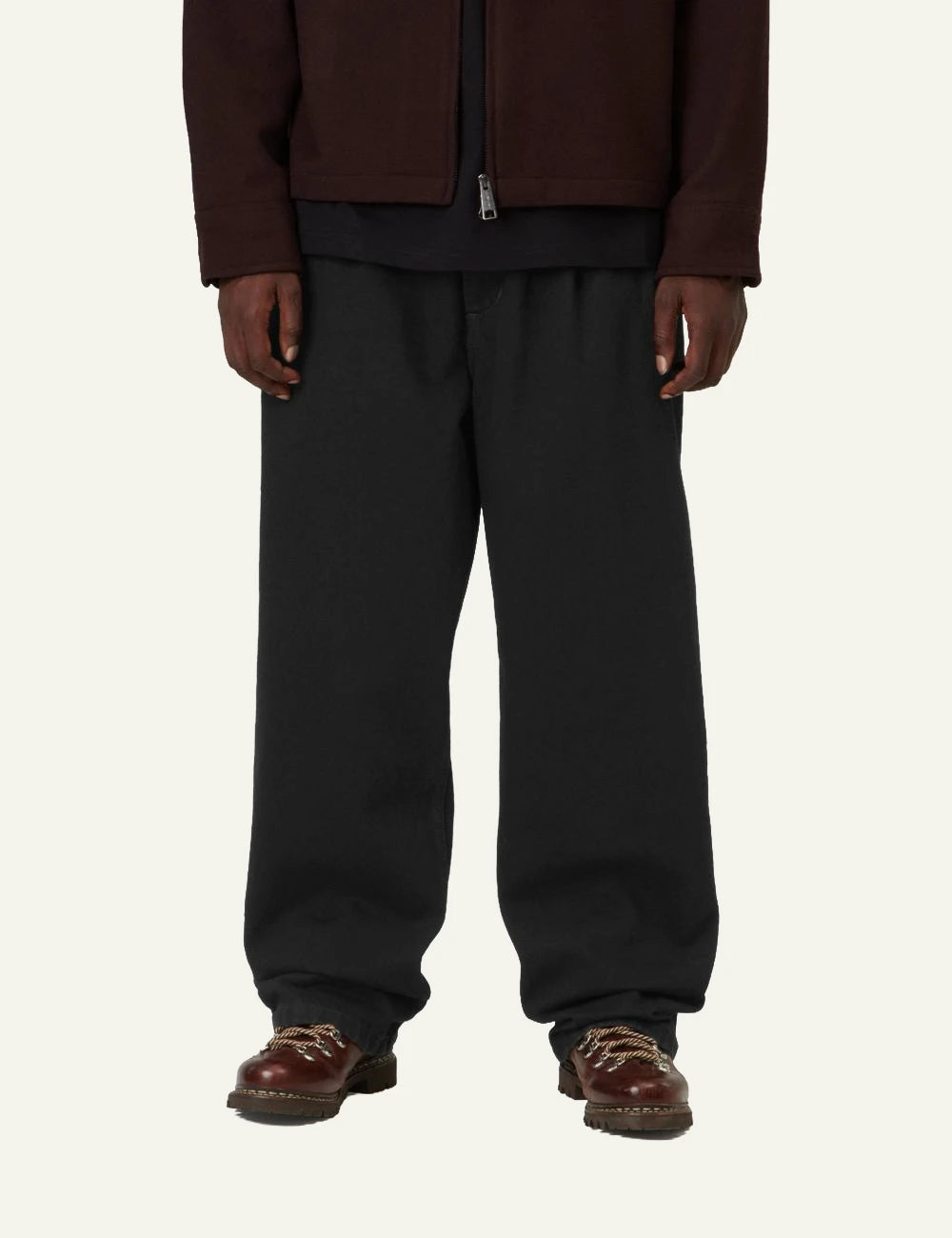 Men's Carhartt WIP Jace Pant in black cotton denim with loose tapered fit model