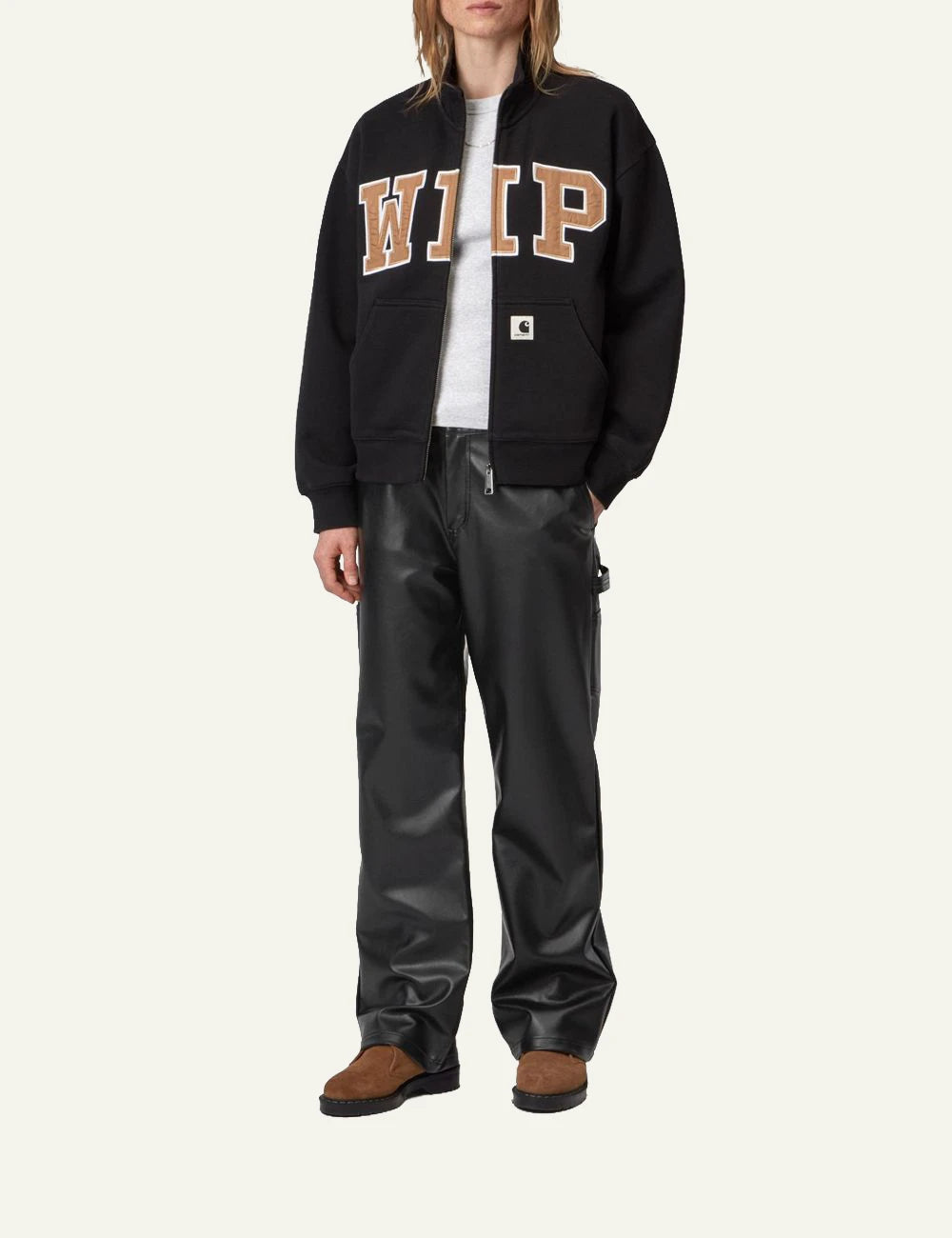 Women's Carhartt WIP black faux leather straight leg work pants with utility pockets full body