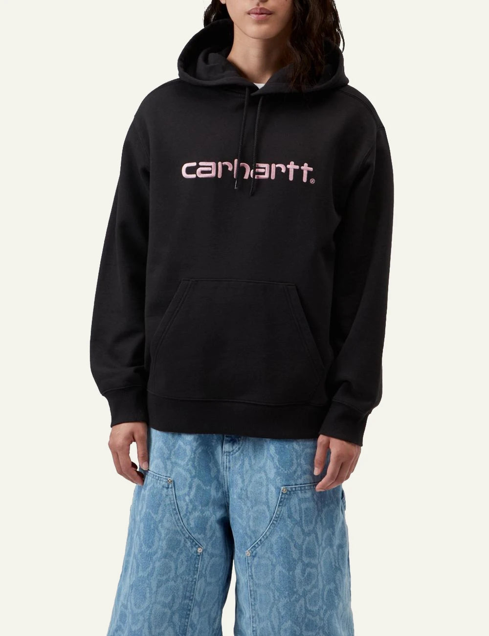 Women's Carhartt WIP black hooded sweatshirt with pink embroidered script logo model