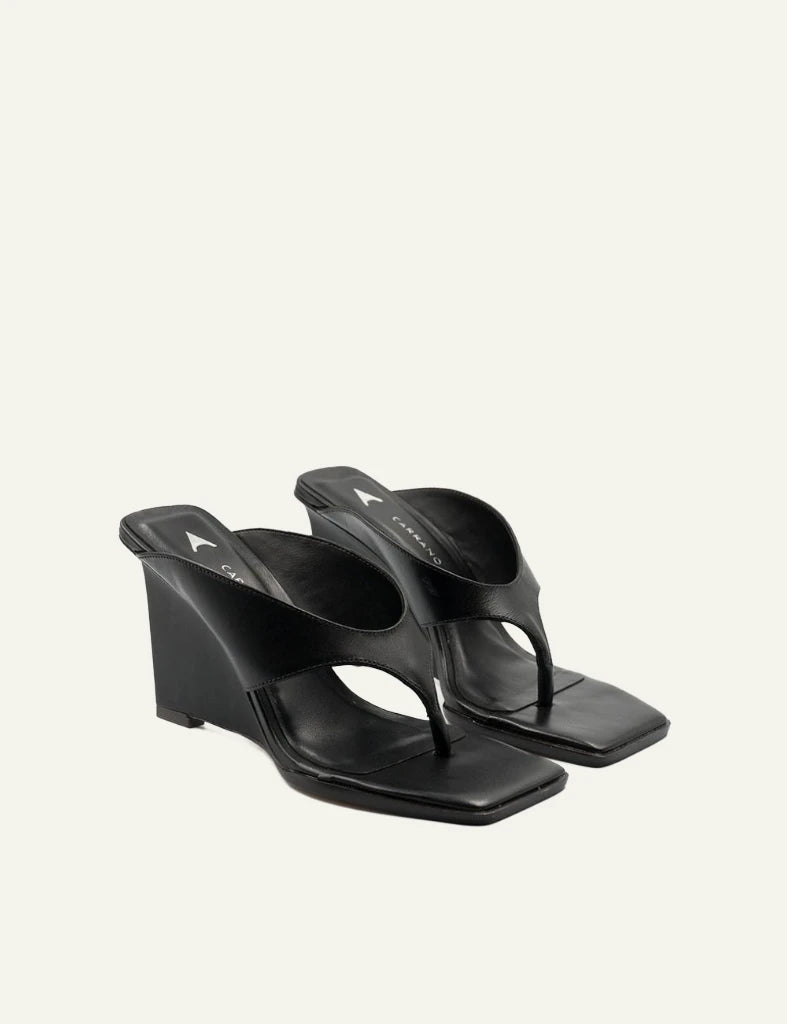 Carrano wedge mule sandal leather black thong square toe angled view