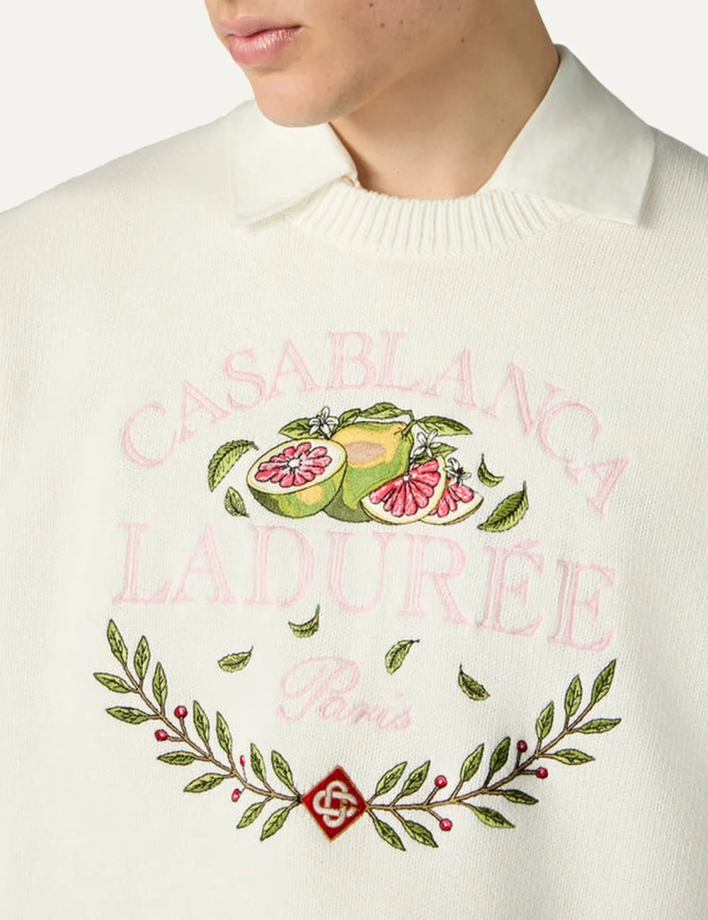 Casablanca x Ladurée unisex off-white cotton knit sweater with embroidered fruit and laurel wreath artwork, pink collaboration lettering, crew neck and ribbed trims detail