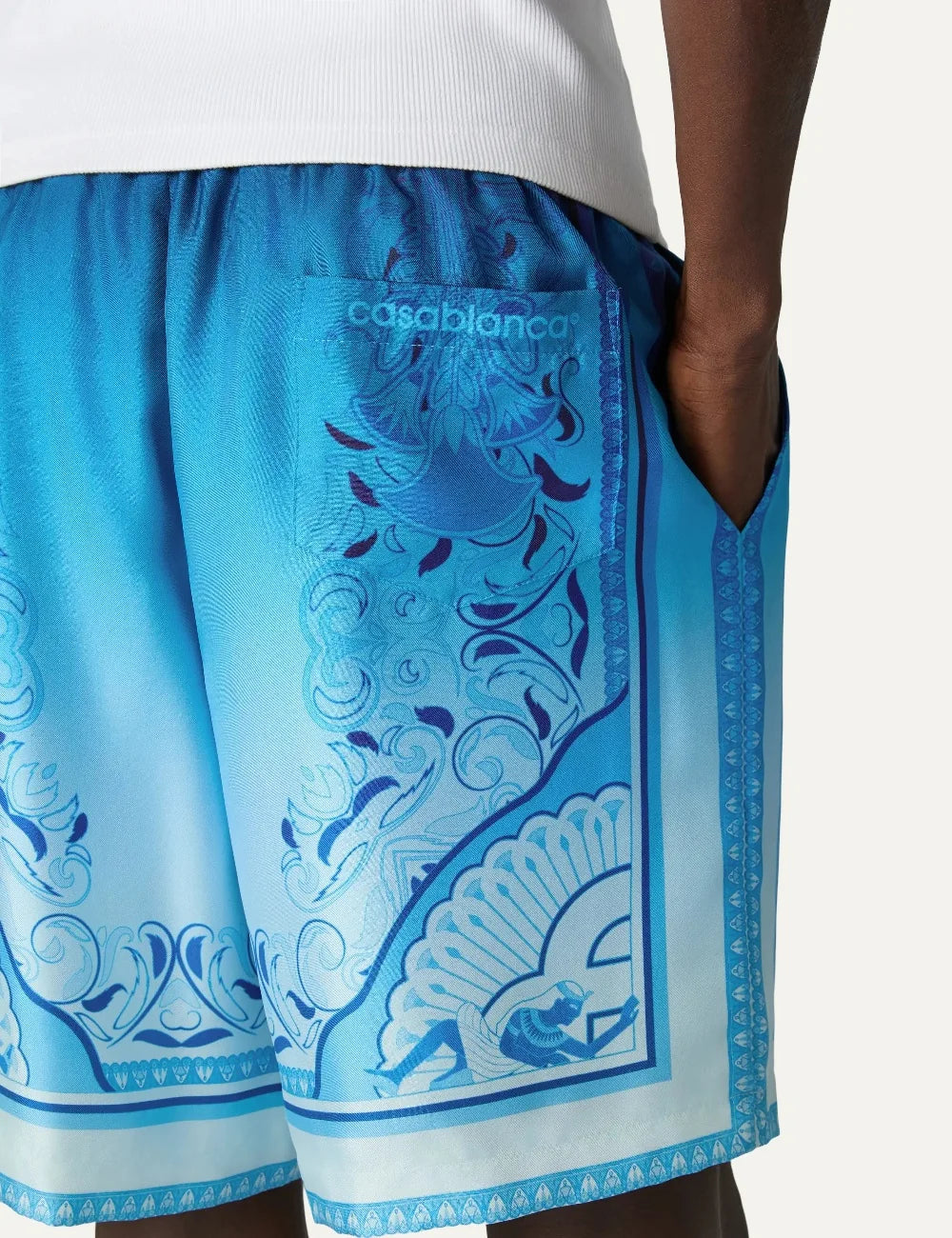 Casablanca men's blue silk shorts with Egyptian-inspired geometric print back detail