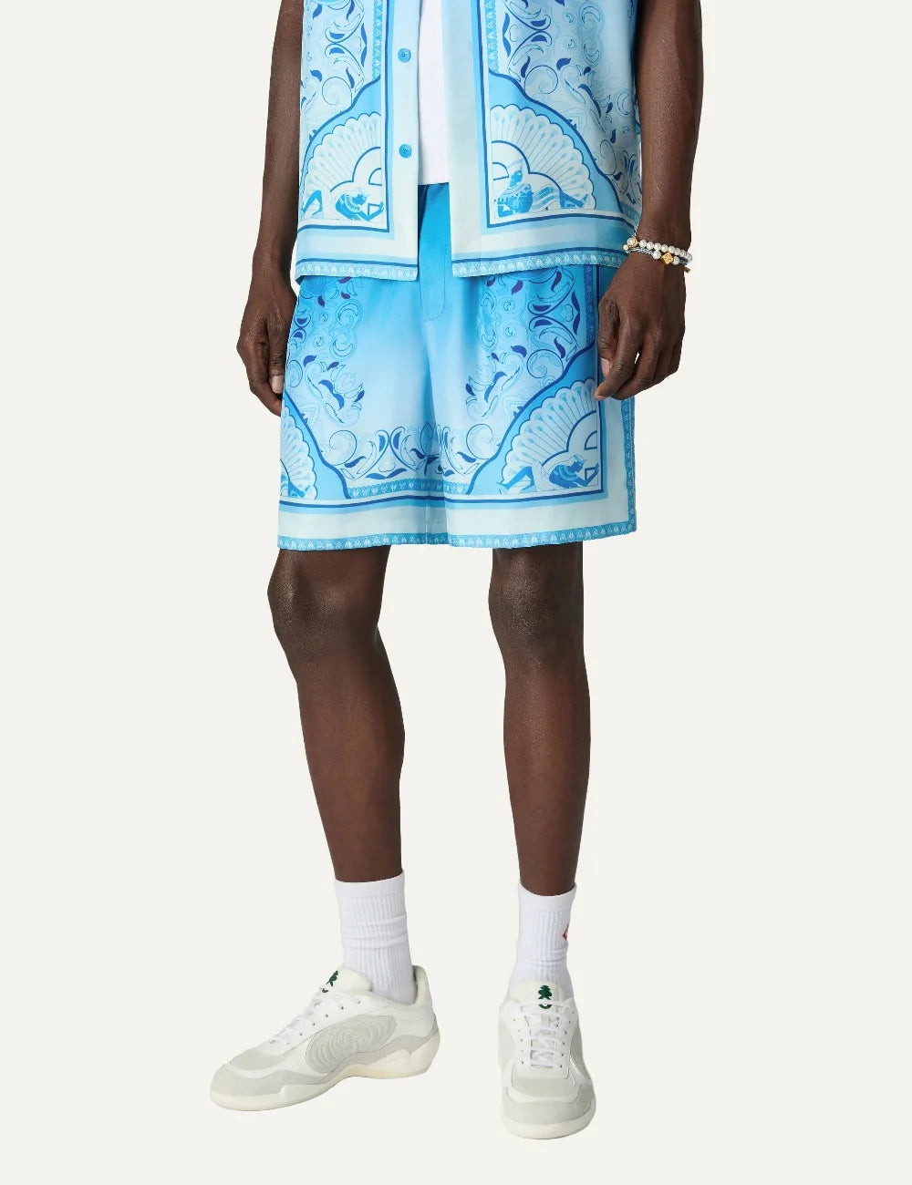 Casablanca men's blue silk shorts with Egyptian-inspired geometric print model