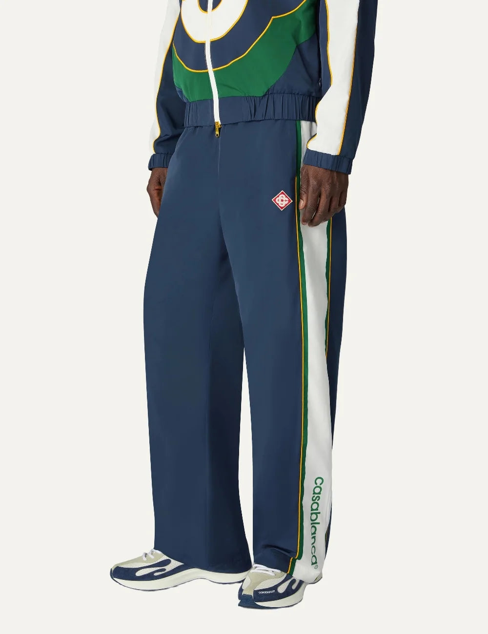Casablanca men's navy polyester track pants with white and green stripes model