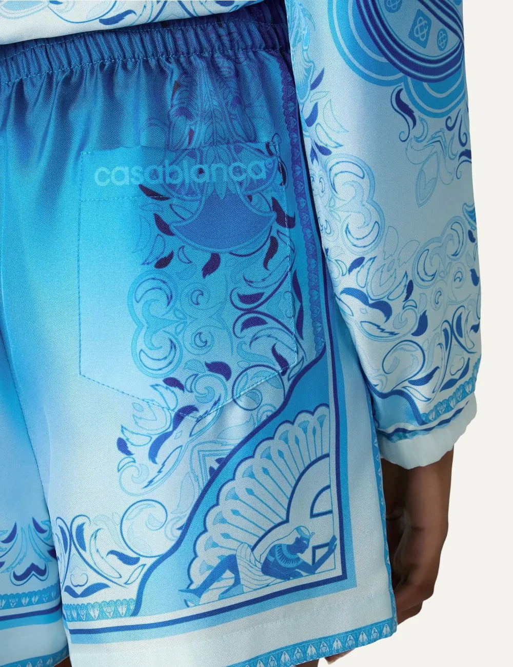 Casablanca men's blue gradient silk shorts with Egyptian Rug print, ornate border detailing and elastic waistband back detail