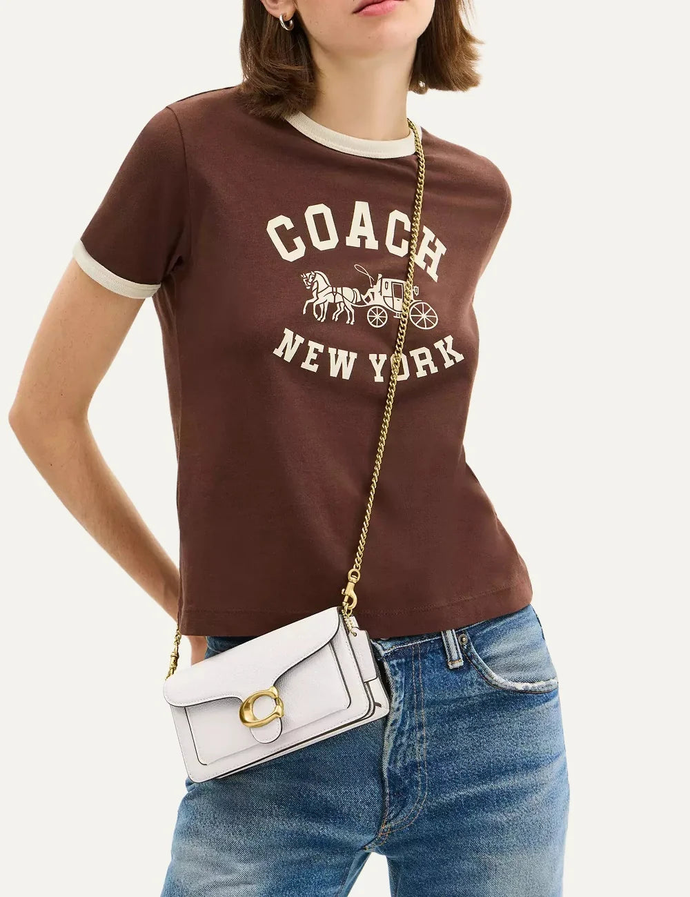 Coach women's Tabby 19 white pebble leather crossbody bag with gold-tone chain and Signature C hardware model