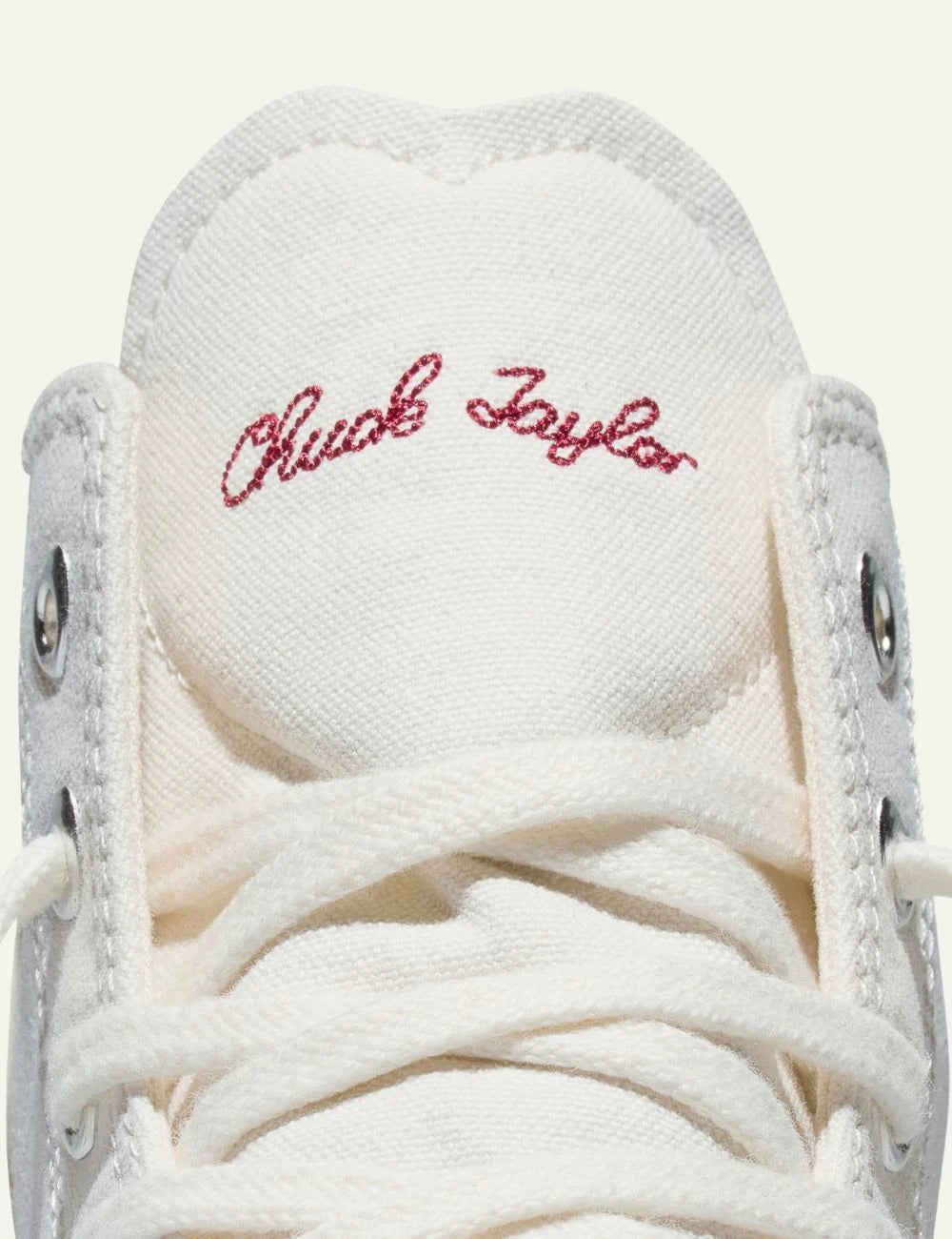 Converse Chuck Taylor All Star hi canvas white sneaker with red love embroidery left detail front view
