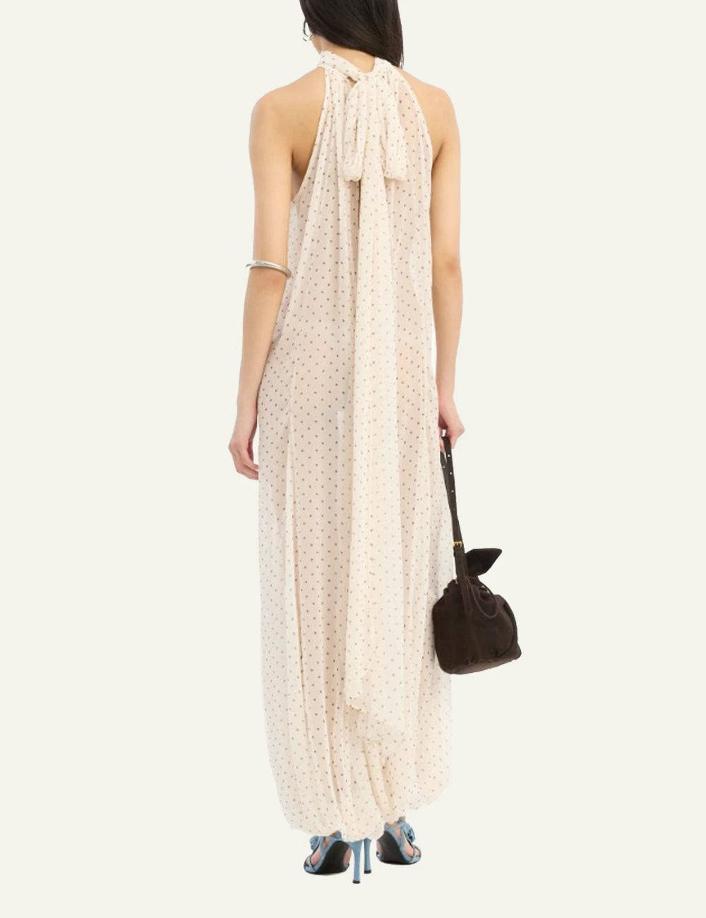 Cream chiffon balloon jumpsuit with halter neckline and polka dot print back model view