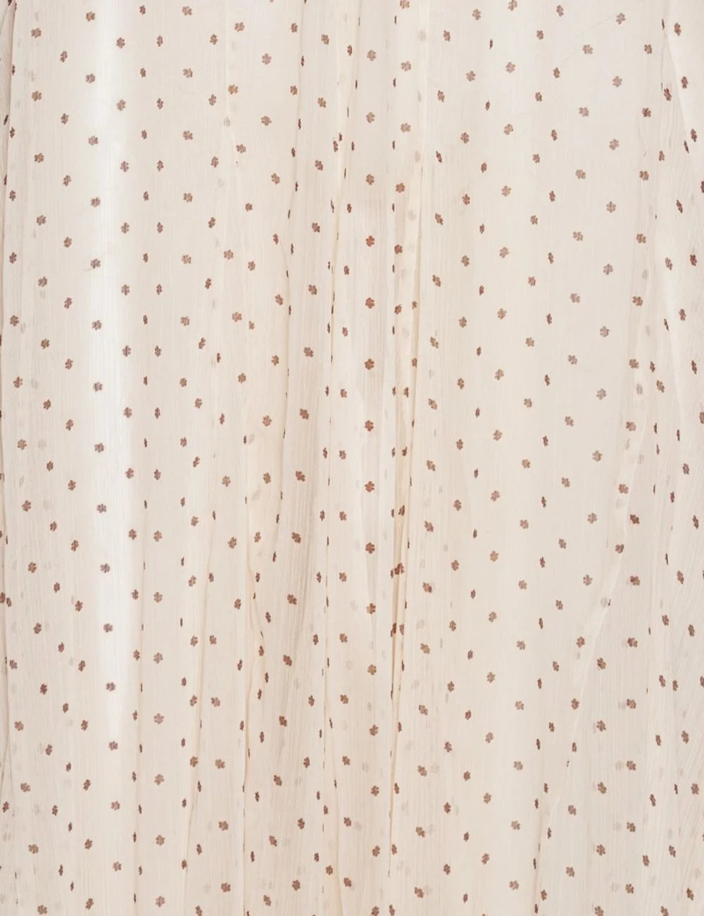 Cream chiffon balloon jumpsuit with halter neckline and polka dot print detail view