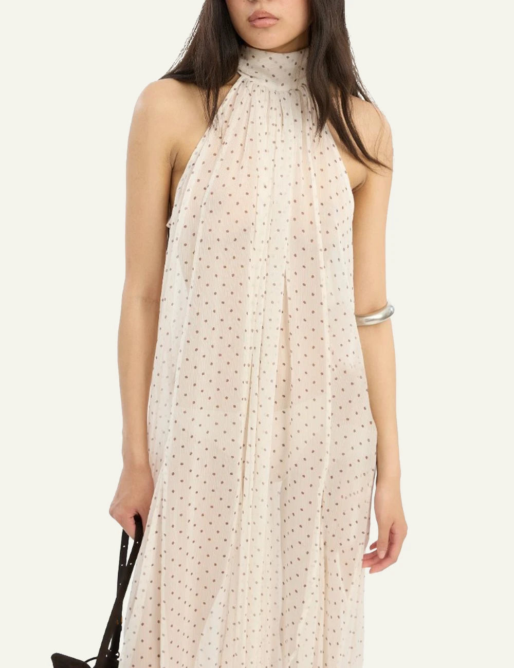 Cream chiffon balloon jumpsuit with halter neckline and polka dot print front model view