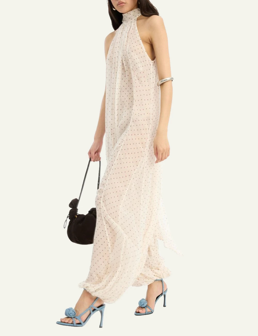 Cream chiffon balloon jumpsuit with halter neckline and polka dot print side model view