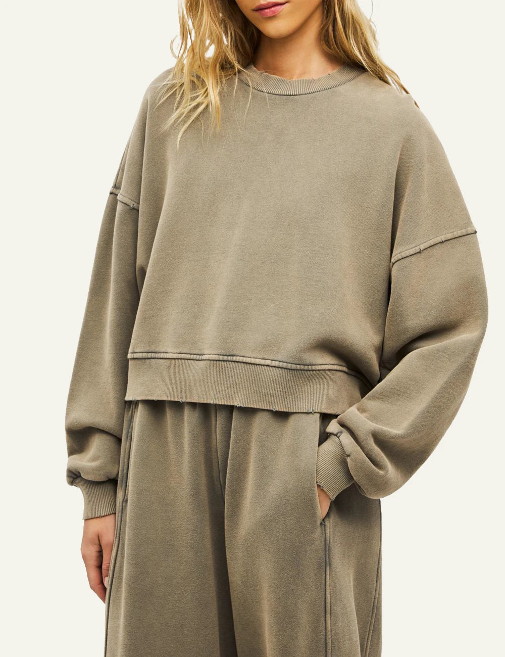 Women's Dirty Laundry faded beige oversized sweatshirt with distressed details model
