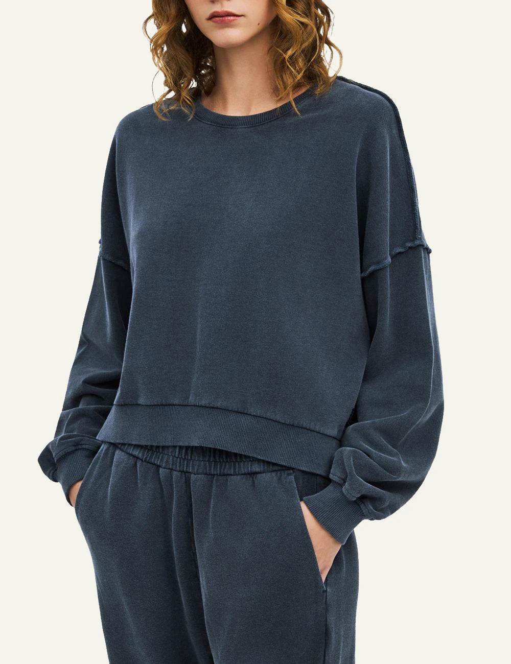 Women's Dirty Laundry faded blue oversized cotton sweatshirt with exposed seams model