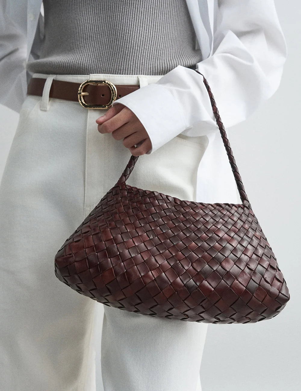 Dragon Diffusion women Rosanna dark brown handwoven buffalo leather baguette shoulder bag on model