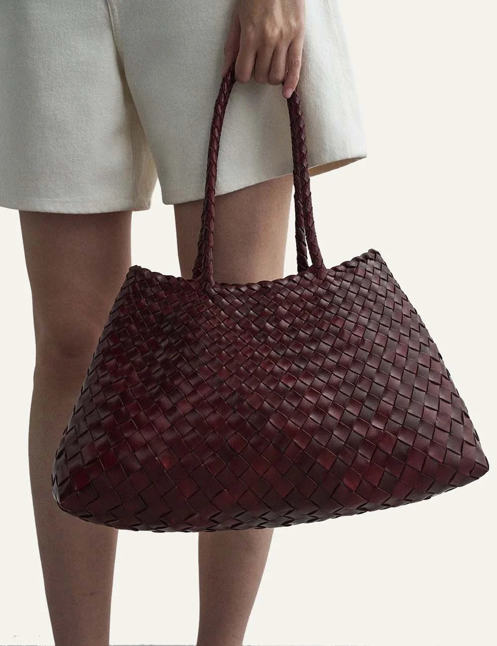 Dragon Diffusion women Santa Croce burgundy handwoven buffalo calf leather shoulder bag  close up view on model