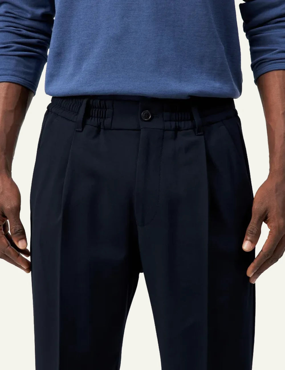 Men's DRYKORN dark navy tailored pants with tapered leg and cropped fit detail